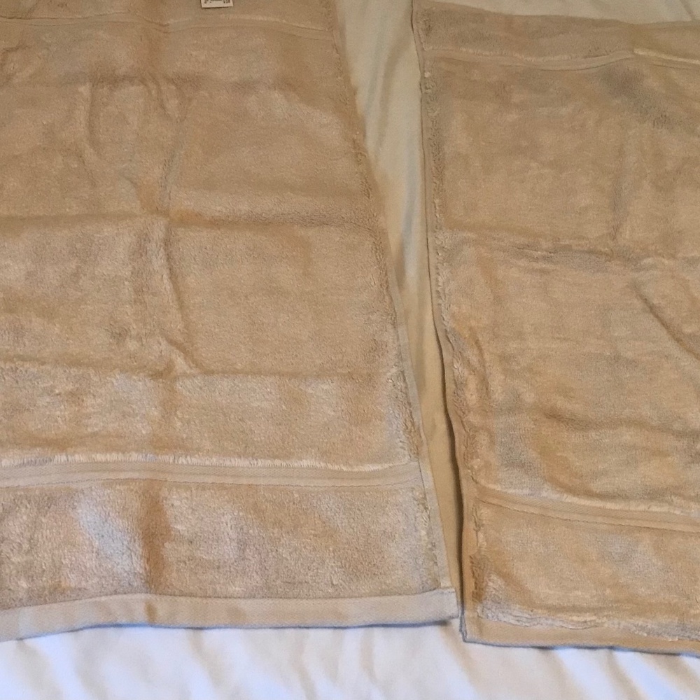 A set of two beige Threshold hand towels